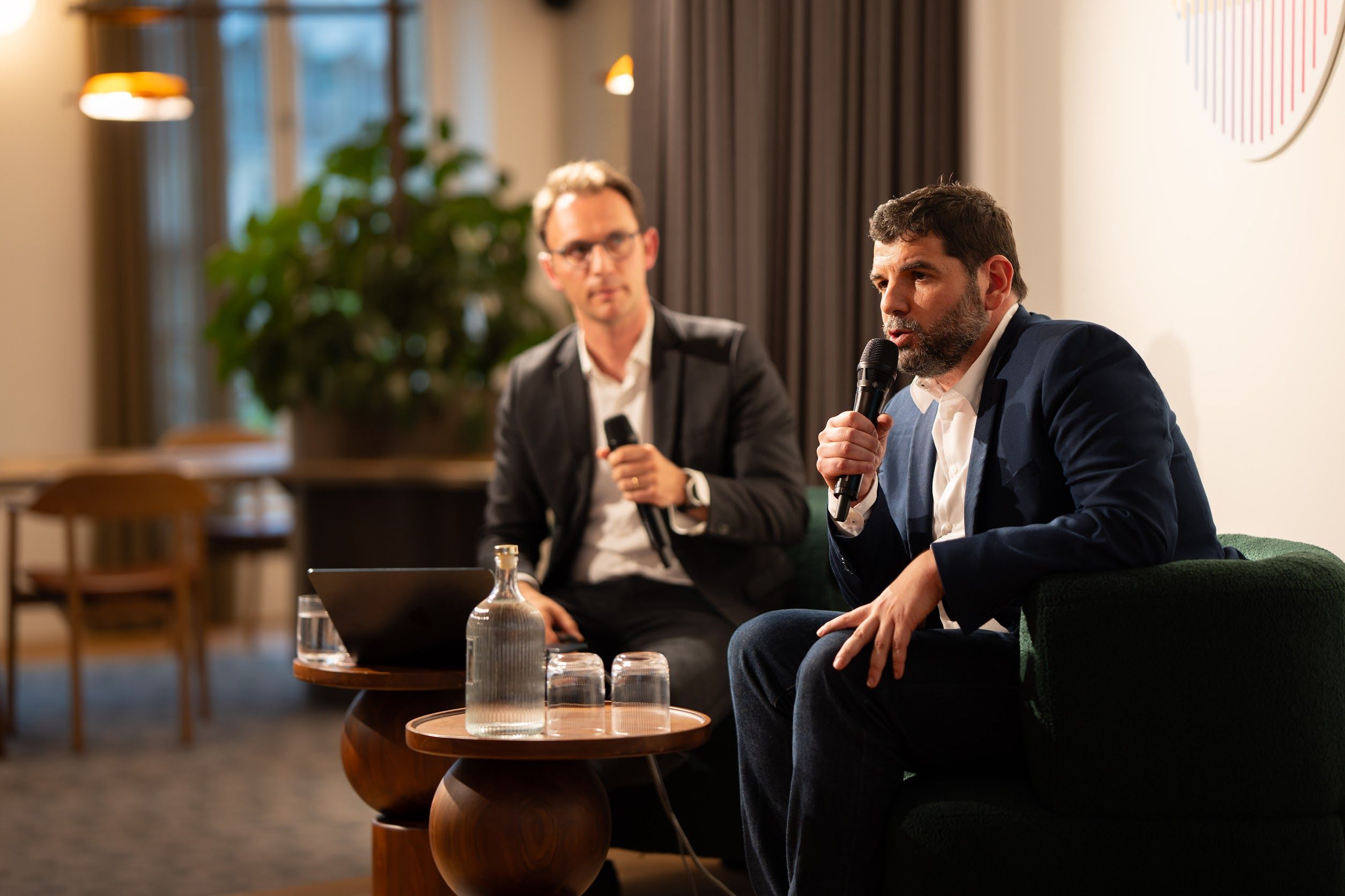 Julien Belon and Pierre-Louis on stage for the integration announcement