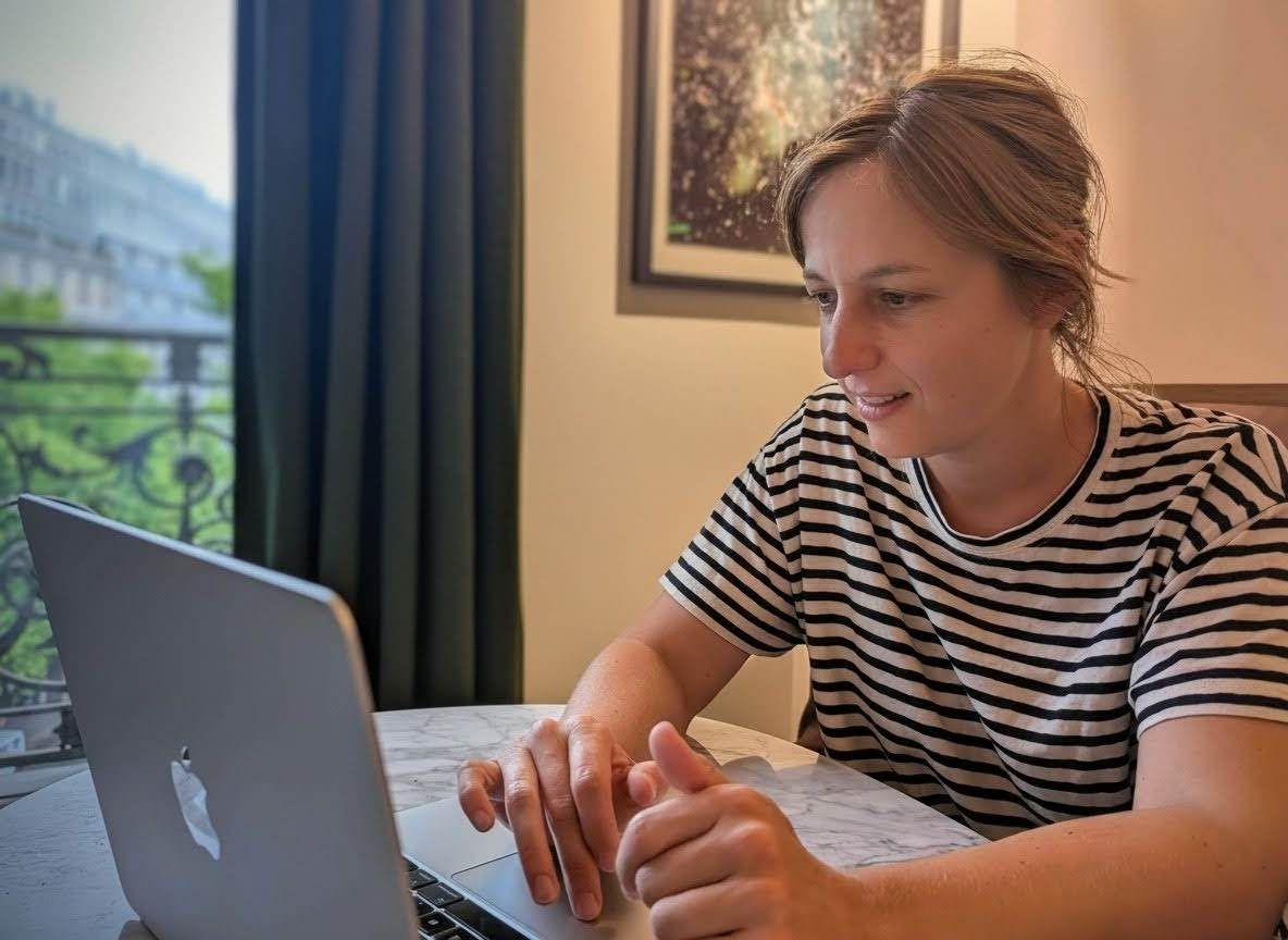 An Entropia team member at work on a laptop